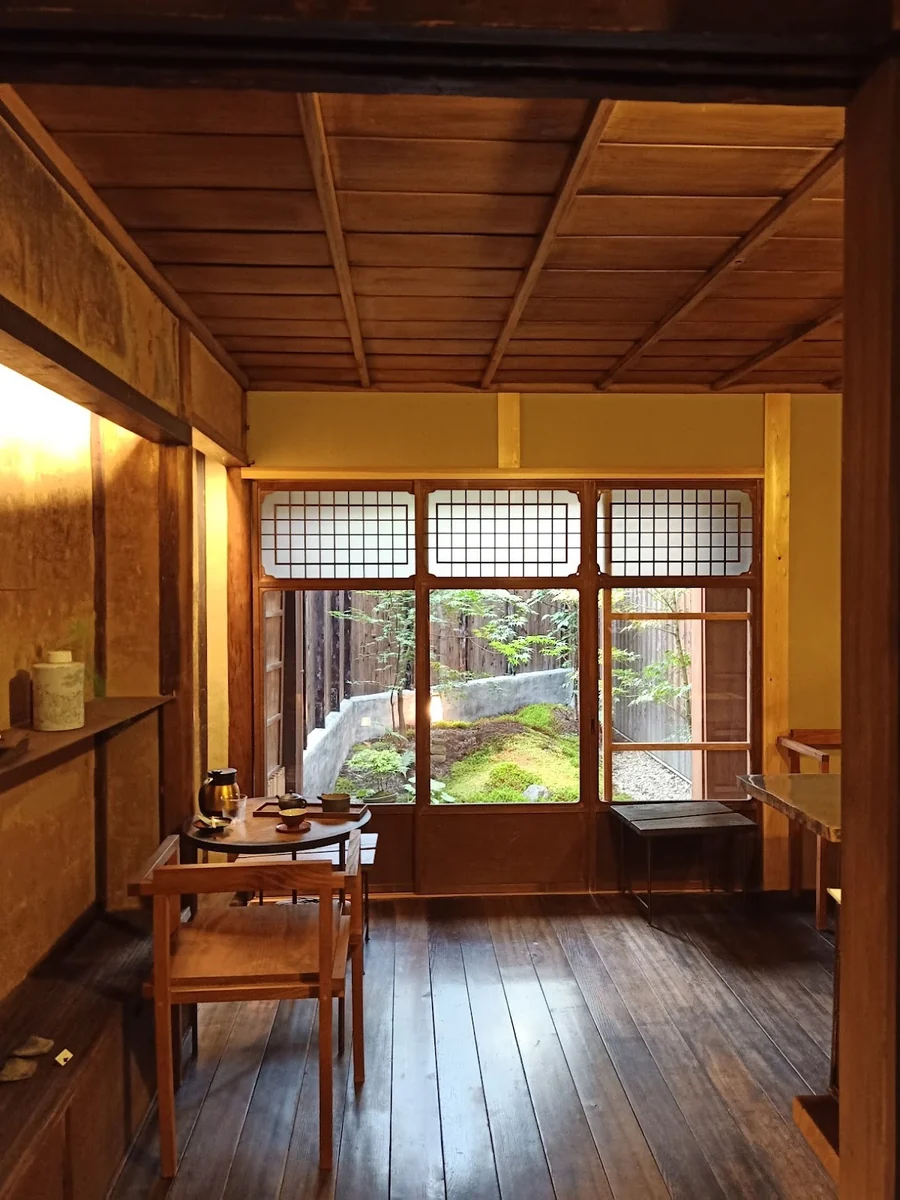 A Japanese garden seen through wooden window frames
