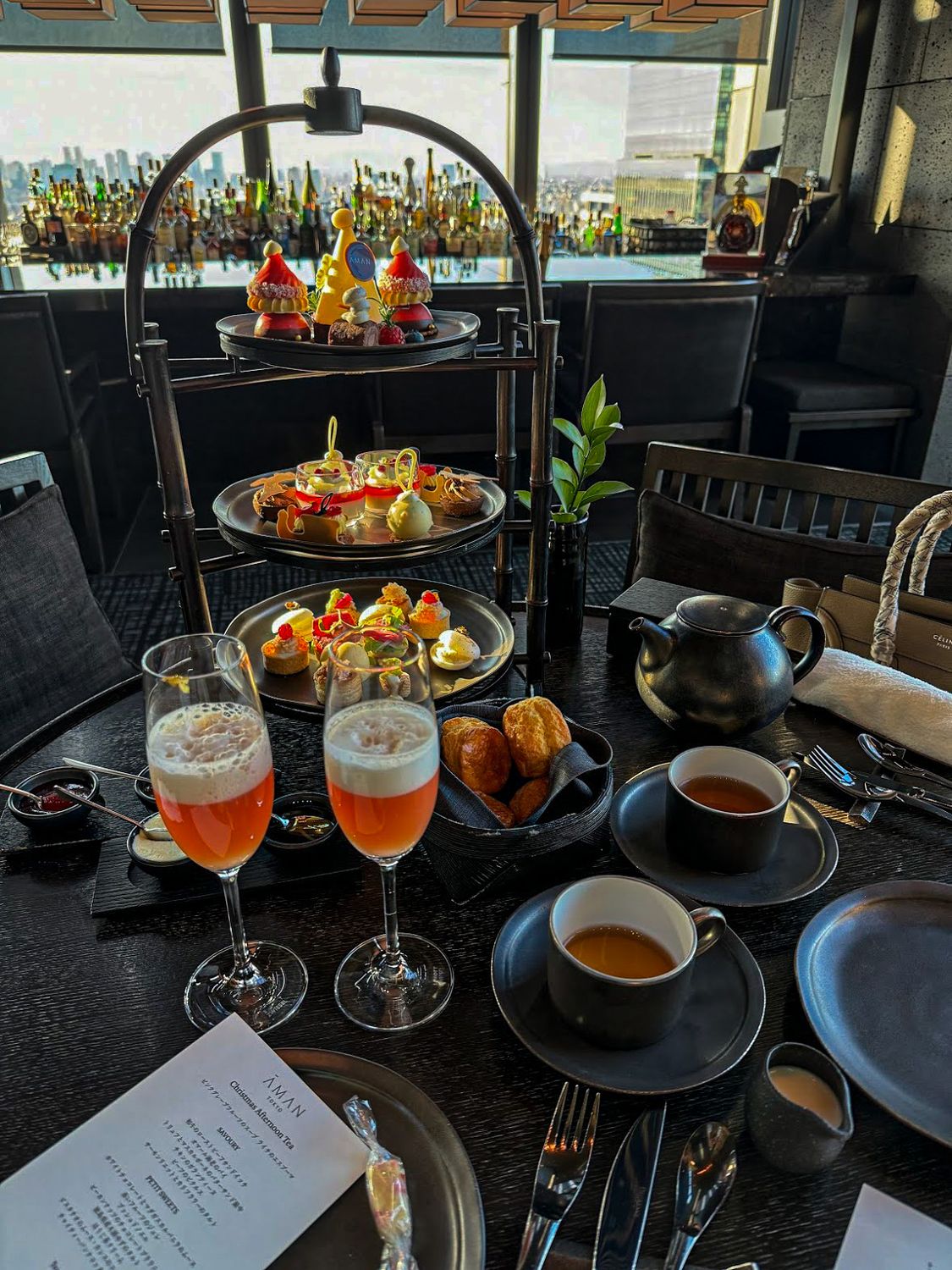 Afternoon tea set beside a high window in Tokyo