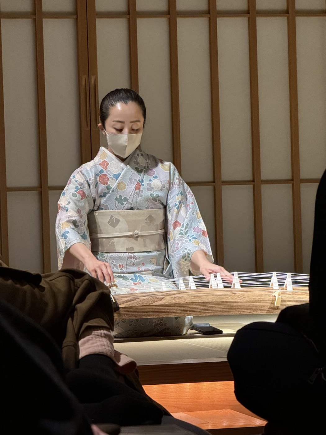 A staff member in kimono preparing tea at HOSHINOYA Tokyo