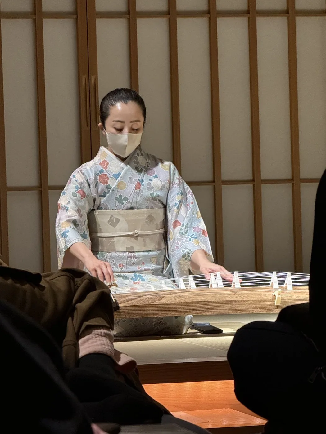 A staff member in kimono preparing tea at HOSHINOYA Tokyo