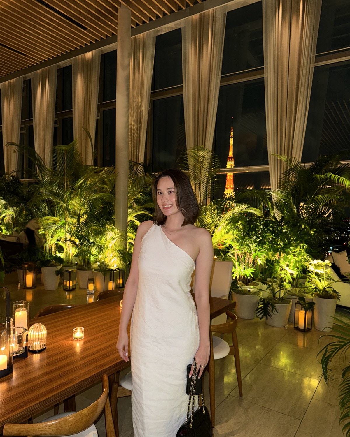 Juno, Tokyo-based Japan travel concierge, at a restaurant overlooking Tokyo Tower