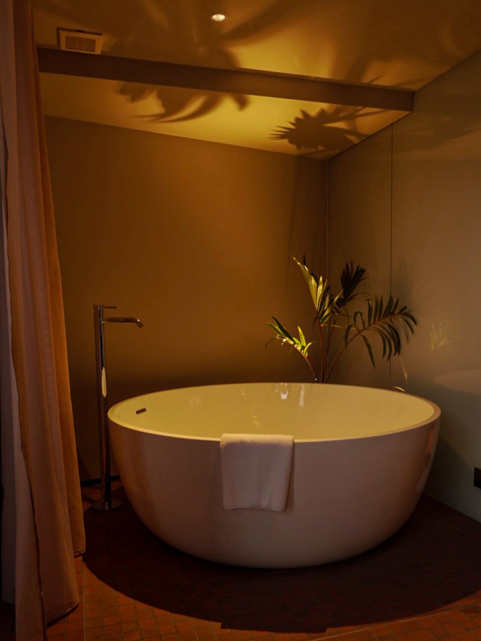 Round freestanding bathtub in a room at SOIL Nihonbashi