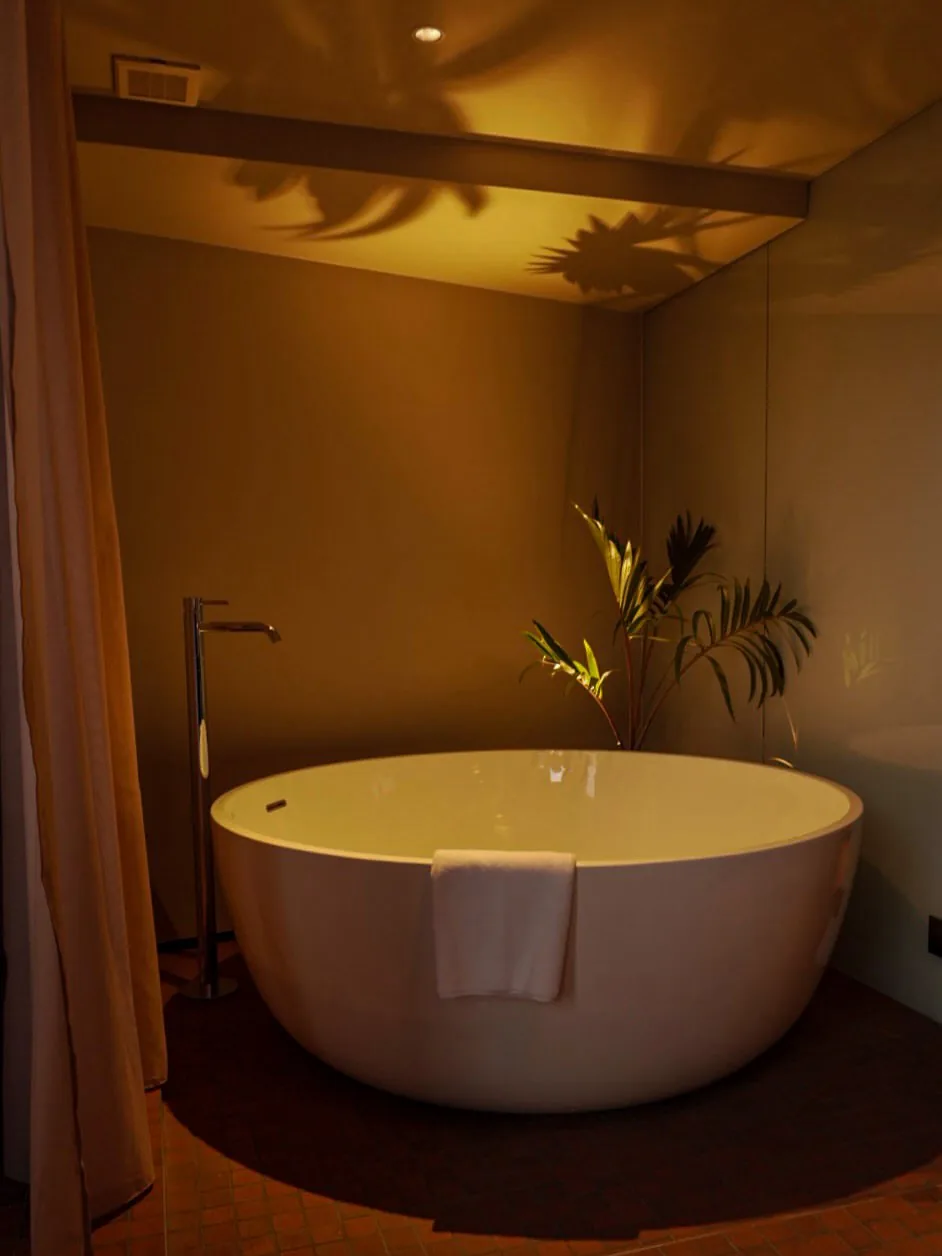 Round freestanding bathtub in a room at SOIL Nihonbashi