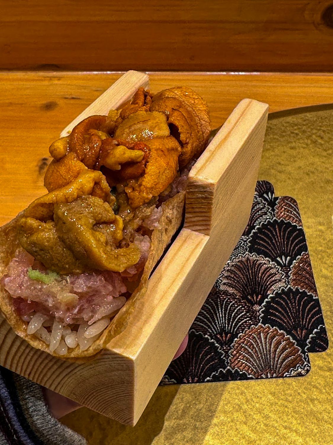 Uni and toro served over rice at a Tokyo sushi counter